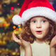 Beautiful little girl in Santa hat Beautiful little girl in Santa hat - PhotoDune Item for Sale