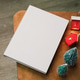 Blank book mockups with Christmas and New Year lights decorations on coffee table Blank book mockups with Christmas and New Year lights decorations on coffee table - PhotoDune Item for Sale