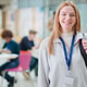Portrait Of Smiling Female College Student In Busy Communal Campus Building Portrait Of Smiling Female College Student In Busy Communal Campus Building - PhotoDune Item for Sale