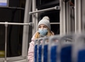 lonely girl in a face mask rides a tram at night in Pandemic time, Poland lonely girl in a face mask rides a tram at night in Pandemic time, Poland - PhotoDune Item for Sale