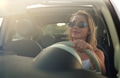 A summer cabriolet trip. A young beautiful girl behind the wheel of a car. Happy girl on vacation. A summer cabriolet trip. A young beautiful girl behind the wheel of a car. Happy girl on vacation. - PhotoDune Item for Sale