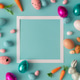 Easter composition made with colorful eggs and carrots on bright blue background. Easter composition made with colorful eggs and carrots on bright blue background. - PhotoDune Item for Sale