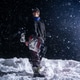 Stylish guy with a snowboard on a black background at night during a snowfall Stylish guy with a snowboard on a black background at night during a snowfall - PhotoDune Item for Sale