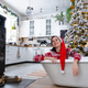 Happy woman in Santa hat is lying resting in New bathtub under Christmas tree as New Year Happy woman in Santa hat is lying resting in New bathtub under Christmas tree as New Year - PhotoDune Item for Sale