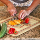 Woman chopping vegetables in kitchen at home Woman chopping vegetables in kitchen at home - PhotoDune Item for Sale