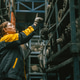 Technician adult women worker working in heavy industry, warehouse manager in garage scrap yard Technician adult women worker working in heavy industry, warehouse manager in garage scrap yard - PhotoDune Item for Sale