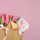 Gift Bag with Pink Tulips and Gift Box on Pink Background. Valentine's or Mother's Day Celebration Gift Bag with Pink Tulips and Gift Box on Pink Background. Valentine's or Mother's Day Celebration - PhotoDune Item for Sale