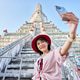 happy thai woman taking seflie at wat arun temple in bangkok thailand happy thai woman taking seflie at wat arun temple in bangkok thailand - PhotoDune Item for Sale