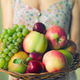 A woman holds a basket with ripe fruits A woman holds a basket with ripe fruits - PhotoDune Item for Sale