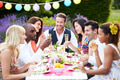 Group Of Friends Enjoying Outdoor Dinner Party Group Of Friends Enjoying Outdoor Dinner Party - PhotoDune Item for Sale
