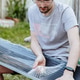 Portrait of a young man unpacking a sheet of metal from a barn. Portrait of a young man unpacking a sheet of metal from a barn. - PhotoDune Item for Sale