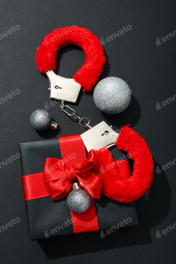 Sex toys with Christmas decorations on a dark background. Stock Photo by AtlasComposer Sex toys with Christmas decorations on a dark background. Stock Photo by AtlasComposer