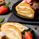 Sliced rolls with custard. The dessert is decorated with fresh strawberries Sliced rolls with custard. The dessert is decorated with fresh strawberries - PhotoDune Item for Sale
