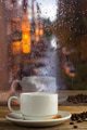 Cup of strong coffee on the rainy window background Cup of strong coffee on the rainy window background - PhotoDune Item for Sale
