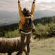 woman with backpack hiking in mountains from behind woman with backpack hiking in mountains from behind - PhotoDune Item for Sale