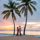 Couple enjoying a romantic sunset stroll on a Saint Lucia beach Couple enjoying a romantic sunset stroll on a Saint Lucia beach - PhotoDune Item for Sale
