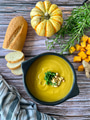 Flat Lay of Butternut Winter Squash Soup on Wooden Surface with Bread and Rosemary Flat Lay of Butternut Winter Squash Soup on Wooden Surface with Bread and Rosemary - PhotoDune Item for Sale
