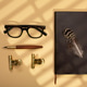Notebook open on a white page with glasses, a pen and a succulent on a beige Notebook open on a white page with glasses, a pen and a succulent on a beige - PhotoDune Item for Sale