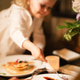 Parents with their curly daughter, having healthy meal together. Nutrition Concept. Parents with their curly daughter, having healthy meal together. Nutrition Concept. - PhotoDune Item for Sale