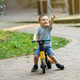 A cute smiling toddler boy of three or four years old rides a bicycle or balance bike A cute smiling toddler boy of three or four years old rides a bicycle or balance bike - PhotoDune Item for Sale