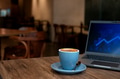Laptop and coffee cup on wooden table Laptop and coffee cup on wooden table - PhotoDune Item for Sale