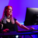 Young woman gaming while streaming with vibrant lighting and stylish hairstyle Young woman gaming while streaming with vibrant lighting and stylish hairstyle - PhotoDune Item for Sale