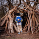 Child Exploring Wooden Stick Fort in Forest Child Exploring Wooden Stick Fort in Forest - PhotoDune Item for Sale