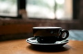 A cup of coffee near window with shadow A cup of coffee near window with shadow - PhotoDune Item for Sale