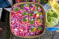 A basket full of flower petals at the market in Bali to be used for offerings A basket full of flower petals at the market in Bali to be used for offerings - PhotoDune Item for Sale