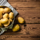 Fresh potatoes. On wooden table. Fresh potatoes. On wooden table. - PhotoDune Item for Sale