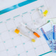 Syringe, test tube, South Korean won money on calendar for medical appointments financial tracking Syringe, test tube, South Korean won money on calendar for medical appointments financial tracking - PhotoDune Item for Sale