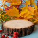 Wooden podium with autumn leaves. the view from above. Flat lay Wooden podium with autumn leaves. the view from above. Flat lay - PhotoDune Item for Sale