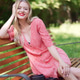 Happy Young Woman Smiling on Park Bench in Summer Happy Young Woman Smiling on Park Bench in Summer - PhotoDune Item for Sale