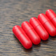 Five Red Capsules Aligned Diagonally Representing Medication Pharmaceutical Concept Five Red Capsules Aligned Diagonally Representing Medication Pharmaceutical Concept - PhotoDune Item for Sale