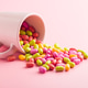 Colorful hard mint Candies in cup on pink background. Colorful hard mint Candies in cup on pink background. - PhotoDune Item for Sale