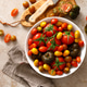 Fresh ripe cherry tomatoes and large red tomatoes, top view Fresh ripe cherry tomatoes and large red tomatoes, top view - PhotoDune Item for Sale