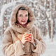 Holding warm drink in snowy forest, smiling mother enjoys winter walk break, hot beverage cup near Holding warm drink in snowy forest, smiling mother enjoys winter walk break, hot beverage cup near - PhotoDune Item for Sale