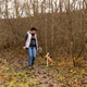 Woman and beagle walking on a muddy path Woman and beagle walking on a muddy path - PhotoDune Item for Sale