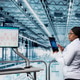 Woman using AI neural network in industry 4.0 factory to optimize conveyor belts Woman using AI neural network in industry 4.0 factory to optimize conveyor belts - PhotoDune Item for Sale