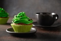 St. Patrick's Day coffee and chocolate cupcakes with green whipped cream. St. Patrick's Day coffee and chocolate cupcakes with green whipped cream. - PhotoDune Item for Sale