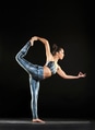 Woman doing a dancer pose during a yoga workout Woman doing a dancer pose during a yoga workout - PhotoDune Item for Sale