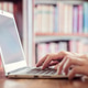 Hands typing on laptop computer in library Hands typing on laptop computer in library - PhotoDune Item for Sale