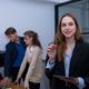 Confident businesswoman stands in modern office, holding tablet, while colleagues work in background Confident businesswoman stands in modern office, holding tablet, while colleagues work in background - PhotoDune Item for Sale