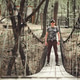Man in Camouflage Shirt on Wooden Suspension Bridge During Spring Man in Camouflage Shirt on Wooden Suspension Bridge During Spring - PhotoDune Item for Sale