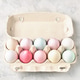 Pastel colored Easter eggs in egg box on light grey background. Pastel colored Easter eggs in egg box on light grey background. - PhotoDune Item for Sale