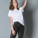 young girl in a white t-shirt and jeans raises her arm young girl in a white t-shirt and jeans raises her arm - PhotoDune Item for Sale