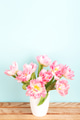 Bouquet of Pink Tulips in White Vase on Wooden Table. Bouquet of Pink Tulips in White Vase on Wooden Table. - PhotoDune Item for Sale