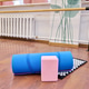 Blue yoga mat with pink block on wooden floor in bright studio Blue yoga mat with pink block on wooden floor in bright studio - PhotoDune Item for Sale
