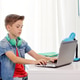 boy with headphones typing on laptop at home boy with headphones typing on laptop at home - PhotoDune Item for Sale