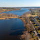 Beautiful view of Valdemarpils, Latvia with river and houses on a sunny day Beautiful view of Valdemarpils, Latvia with river and houses on a sunny day - PhotoDune Item for Sale